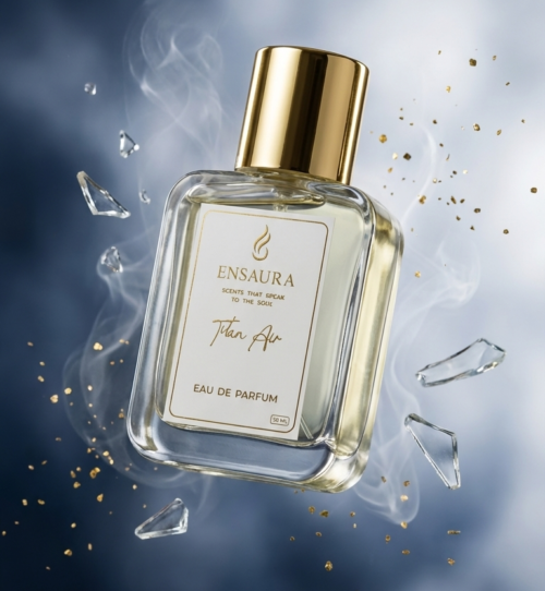 Luxury Ensaura Titan Air Eau de Parfum bottle with gold cap surrounded by mist and glass shards on a blue background